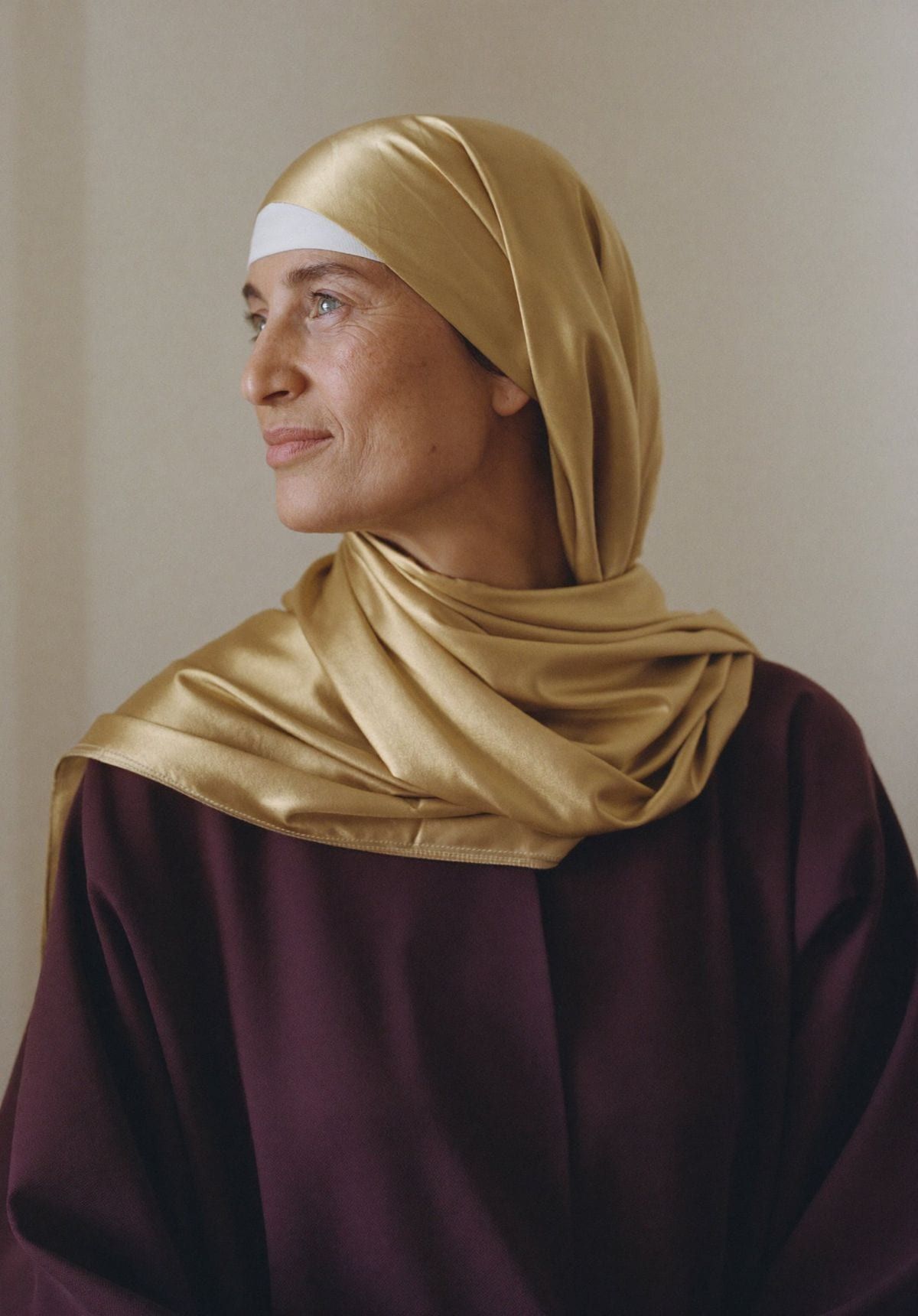 An Arab woman in her fifties, calm and confident, finding her direction through menopause