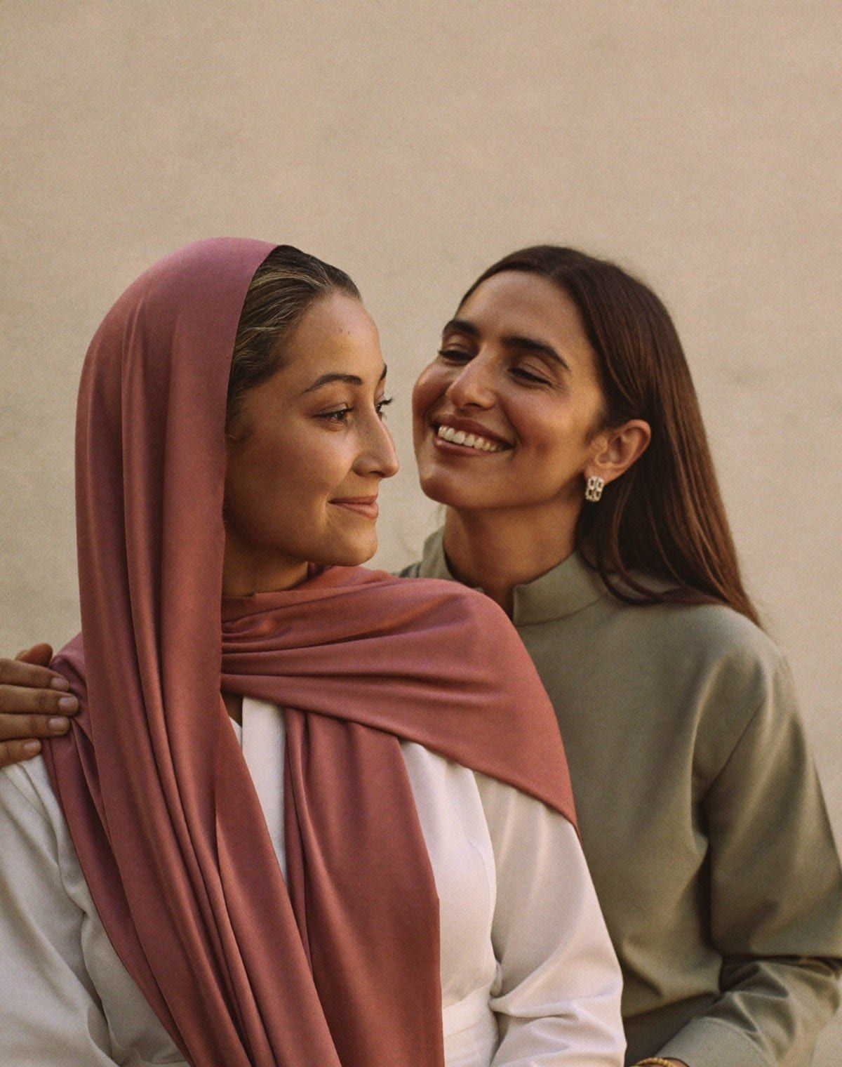 A woman and her adult daughter sharing a warm, supportive moment